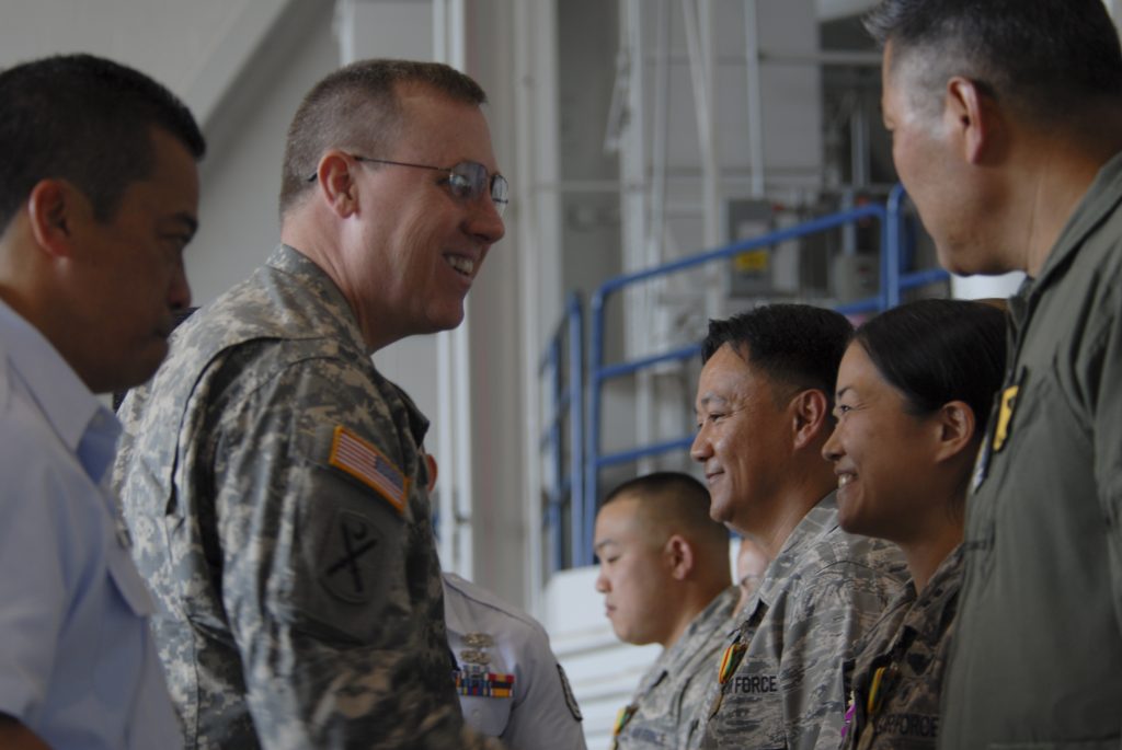 Brig. Gen. Joe Logan, the adjutant general for the state of Hawaii, congratulates Hawaii Air National Guard Launa ‘ole awards winners. (U.S. Air National Guard photo by Senior Airman Orlando Corpuz)