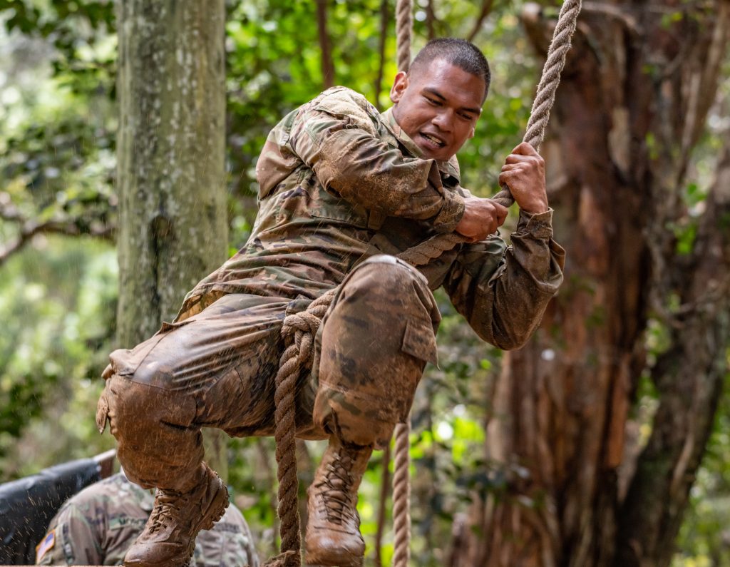Spc. Kaulana Saltiban, with the 230th Engineer Company, maneuvering through an obstacle in his timed run through the obstacle course during the 2020 Best Warrior Competition held at Schofield Barracks, Hawaii, from March 6-8, 2020. The Best Warrior will receive the opportunity to represent the Hawaii Army National Guard at the Regional level. (U.S. Army National Guard photo by Sgt. John Schoebel)
