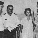 CPT Gary Hara administers the oath of enlistment to Kenneth. In the background, Dennis, LTC Henry Hara, mother Janet, and Larry