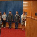 COL Hara administering the oath to his son Justin