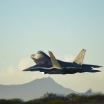 A F-22 Raptor, from the 199th Fighter Squadron, increases altitude shortly after taking off from Joint Base Pearl Harbor-Hickam, Hawaii, June 6, 2015. Pilots of the F-22 from the Hawaii Air National Guard’s 199th Fighter Squadron and the 19th Fighter Squadron teamed up with maintenance Airmen from the 154th Wing and 15th Maintenance Group to launch and recover 62 Raptors in a day. The previous record was 46 sorties in one day with 14 aircraft, this recorded was broken using only 12 of the 18 aircraft in the smallest F-22 squadron in the Air Force. (U.S. Air Force photo by Tech. Sgt. Aaron Oelrich/Released)