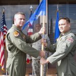Colonel John York, commander,154th Ops Group presents the 154th Operations Support Squadron guidon to Lt. Col. Troy Cullen during Cullen's assumption of command ceremony held at Joint Base Pearl Harbor-Hickam, Hawaii, January 7, 2017. The assumption of command ceremony is a time honored military tradition in which the incoming commander assumes command of a unit. (U.S. Air National Guard photo by Staff Sgt. James Ro)