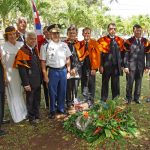 Royal order of Kamehameha I, Hawaii Chapter members and Hawaii Army National Guard officers pose at the gravesite of American Civil War veteran J.R. Kealoha. Standing in the back with the flag are retired HIARNG Soldiers Master Sgt. Haines Rego and State Command Sgt. Maj. James Kahalehoe. Col. Moses Kaoiwi Jr., 29th Infantry Brigade commander and director of Joint Staff, and Col. Stephen F. Logan, HIARNG chief of staff, represent currently serving Soldiers.