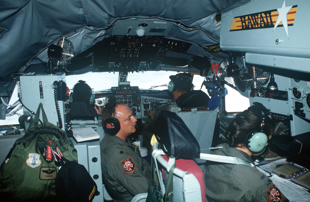 During a Dissimilar Air Combat Tactics (DACT) Exercise over the Hawaiian islands, members of the 203rd Air Refueling Squadron, Hawaii Air National Guard, prepare their KC-135 for refueling missions for the participants.
