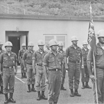 Not all Officer Candidates are in this photograph. Formation leader Wayson Wong, guideon bearer John Amadeo. 1st row L-R: Alan Arakaki (Air), Skip DeMello, Billy Fernandez. 2nd row L-R: John Flores, Norm Nitta (Air), Roy Tanahara, Gervin Miyamoto. Last row L-R: Fred Camit, Cadre member Miles Nakatsu.
