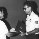Dennis Dalen receiving an award from Colonel Melvin Morris, the 201st Combat Communications Group commander. The photograph was taken in 1990.