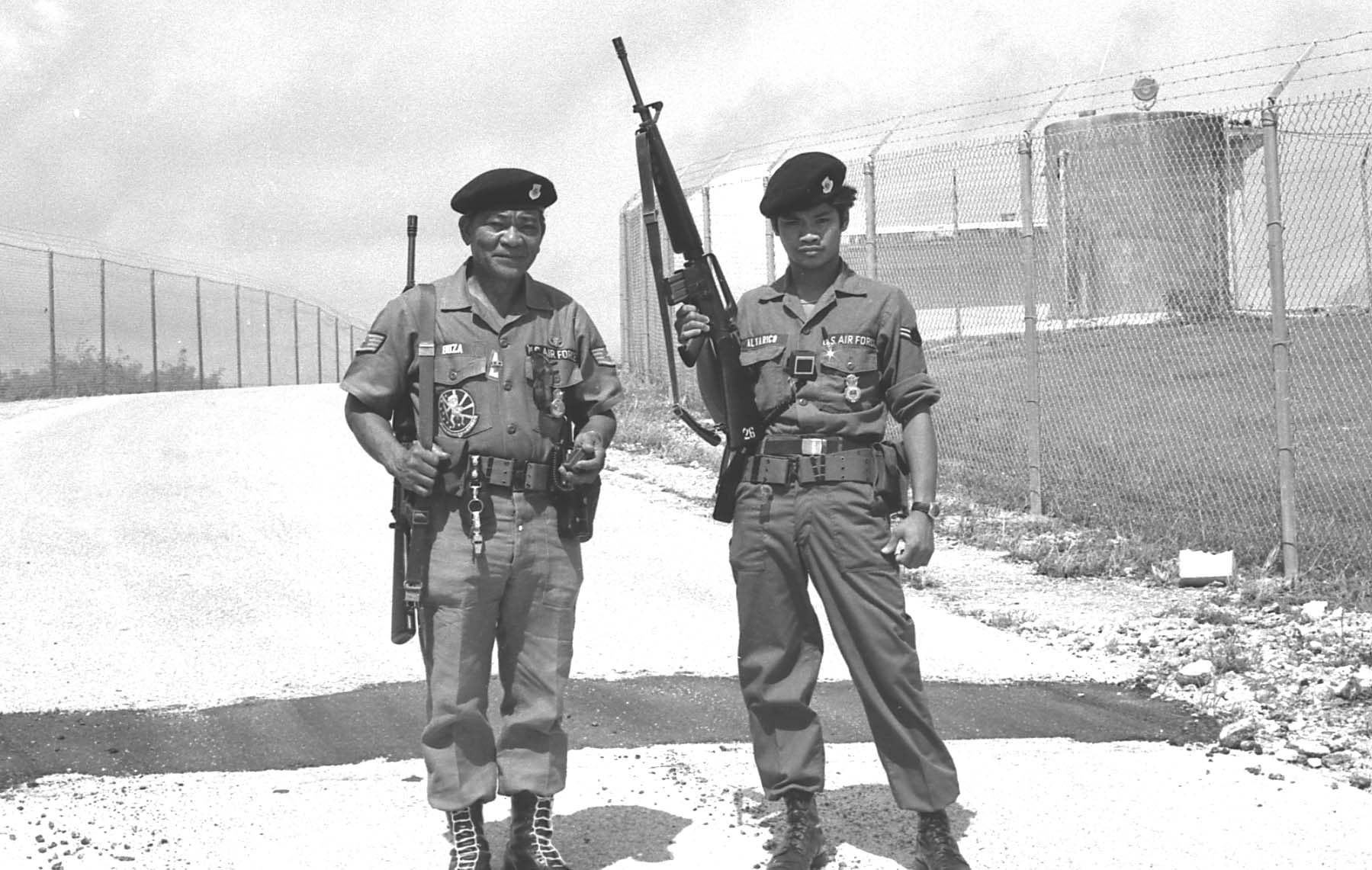 Retiree News asked Norman Nitta and Myron Dobashi for help describing this photograph.  Both agree that the airman on the left is Juanito Buza of Kekaha, Kauai, but neither cannot identify the airman on the right. The facility in the background is not Kokee AFS, but may be Mt. Santa Rosa on Guam. The photograph is probably from the 1980s when the 150 AC&WS deployed often to Guam.