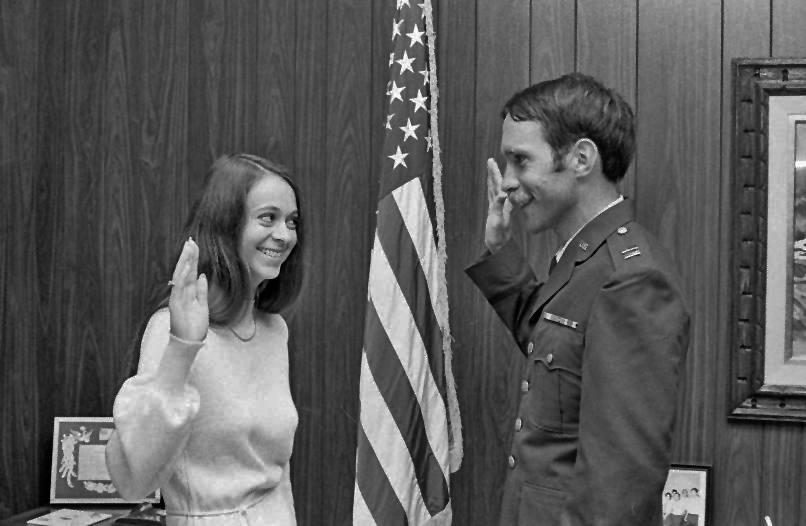 The photograph above shows Kathleen Berg being sworn in by her husband Stephen Berg. The date is in early 1977 because she was commissioned in August 1977.

