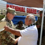 The Adjutant General, Major General Arthur ‘Joe’ Logan shakes hands with Mr. George Kaho’ohanohano after the Armory Memorialization Ceremony at the Pu’unene Armory in Kihei, Maui, October 13, 2017. The dedication ceremony honored Private First Class Anthony T. Kaho’ohanohano for his selfless service during the Korean War. (U.S. Army National Guard photo by Spc. Lisa K. Lariscy)