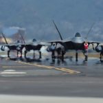 Airmen from the Hawaii Raptors conduct an end of runway inspection of several F-22 Raptors as they return from a six-month deployment to the Central Command area of responsibility, Joint Base Pearl Harbor-Hickam, April 8, 2016. The Hawaiian Raptors are made up of F-22 pilots from the 199th Fighter Squadron and the active-duty 19th Fighter Squadron and are supported by the Hawaii Air National Guard’s 154th Maintenance Squadron and the active-duty 15th Maintenance Squadron. This marked the first operational deployment for the Hawaiian Raptors. (U.S. Air Force photo by Tech. Sgt. Aaron Oelrich/released)