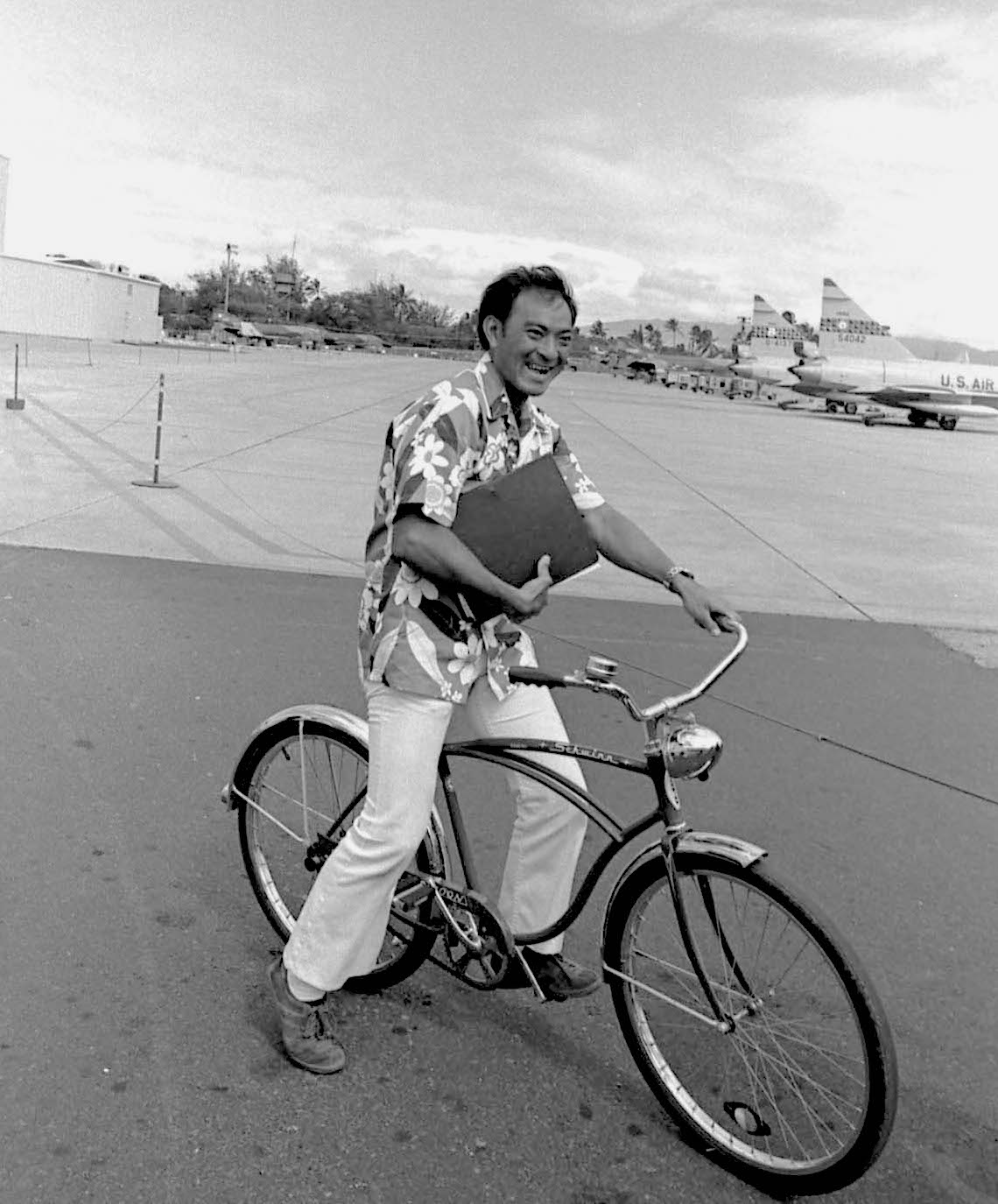 This photograph shows Wayne Soma, who served with 154th Wing as a radio maintenance technician during the F-102 Delta Dagger, F-4C Phantom and the F-15 Eagle eras. This photograph was taken during the F-102/F-4 conversion period because there are Deuces and Phantoms in the photograph.

