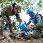 U.S. Air Force Staff Sgt. Maritza Garcia, 154th Medical Group Detachment 1 medic and Tactical Combat Casualty Care instructor, evaluates Armed Forces of the Philippines students during a medical field training exercise May 29, 2025, at Camp O’Donnell, Philippines. The training emphasized rapid response and effective medical treatment in high-pressure environments. (U.S. Air National Guard photo by Tech. Sgt. John Linzmeier)