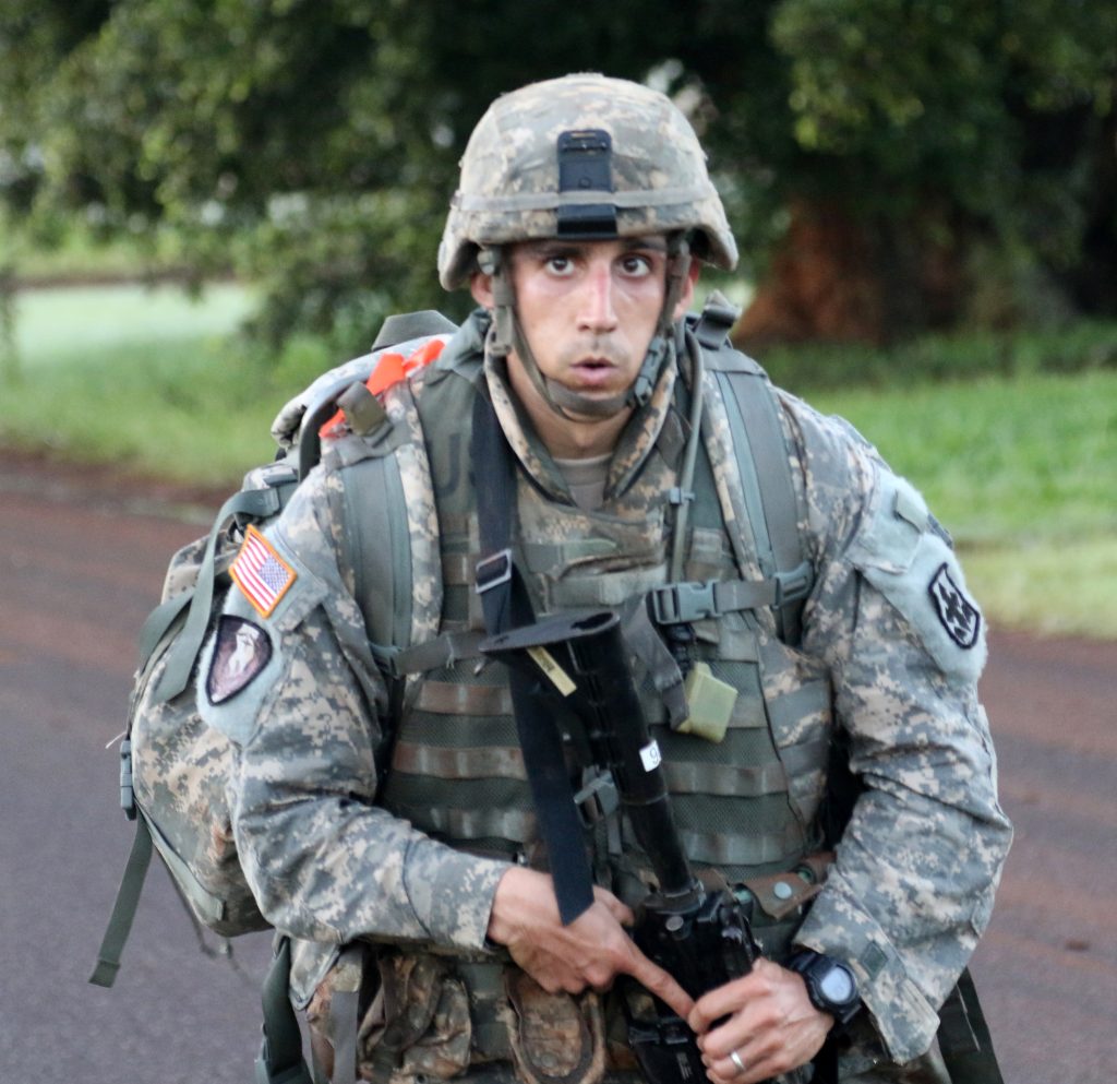 U.S. Army Staff Sgt. Brian Woods, assigned to Alpha Company, 29th Brigade Support Battalion, Hawaii Army National Guard, takes a deep breath as he nears the midway point of a twelve mile road march during the Hawaii best warrior competition March 5, 2017. The grueling three-day competition tested Soldiers on numerous warrior tasks, and included several events designed to test each Soldier’s mental and physical endurance. Staff Sgt. Woods’ performance during the competition earned him the title of the 2017 Hawaii Army National Guard non-commissioned officer of the year.