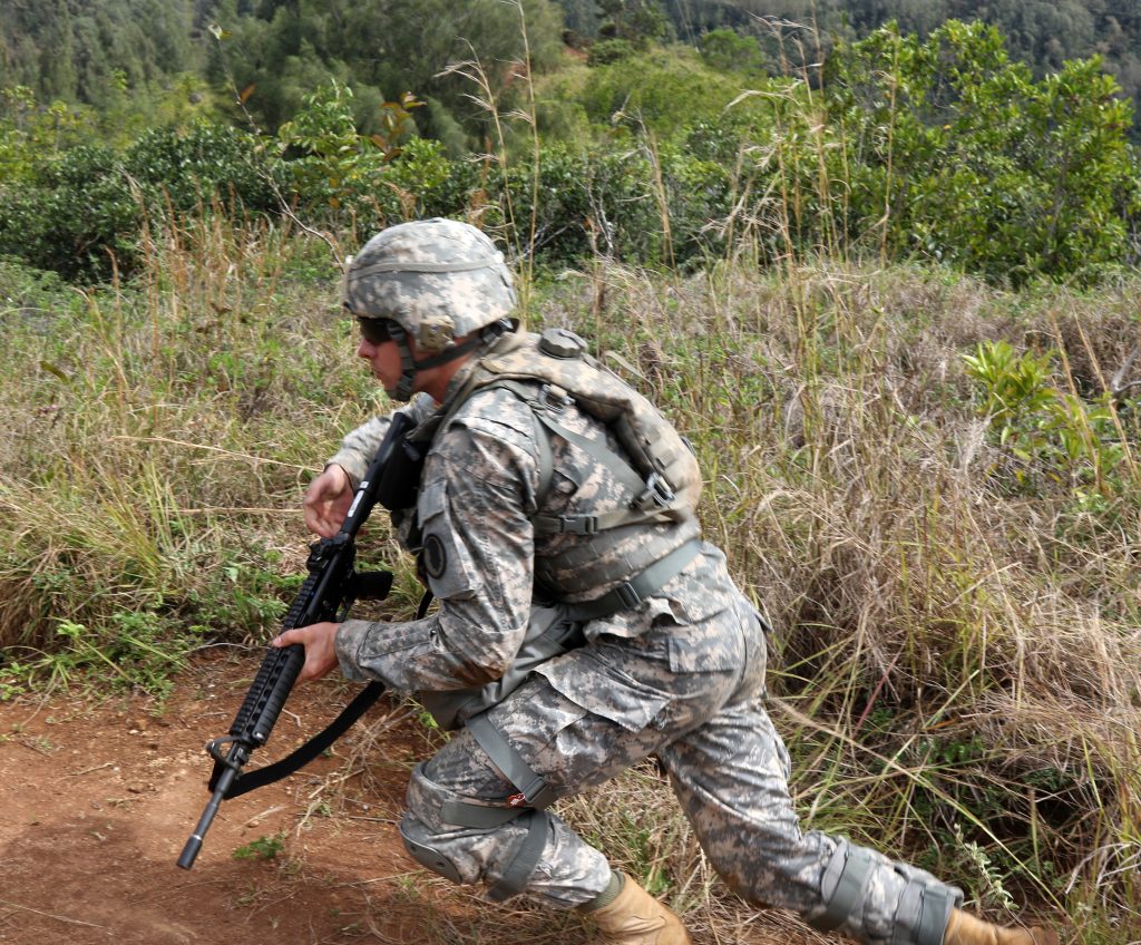 U.S. Army Spc. Pual Berzinas bounds forward while reacting to simulated direct fire during the warrior tasks portion of the Hawaii Best Warrior Competition March 4, 2017. The grueling three-day competition tested Soldiers on numerous warrior tasks, and included several events designed to test each Soldier’s mental and physical endurance. Spc. Berzinas’ performance during the competition earned him the title of the 2017 Hawaii Army National Guard Soldier of the year.