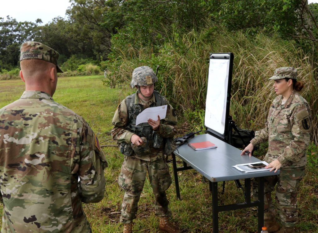 Pfc. William I. Brady of 3rd Platoon, Alpha Troop, 1st Squadron, 299th Cavalry Regiment gives a 9 line MEDEVAC report during a training event at the Best Warrior Competition at Schofield Barracks, Hawaii, March 3, 2018. The Best Warrior Competition recognizes Soldiers who demonstrate commitment to the Army Values, embody the Warrior Ethos, and represent the Force of the Future. (U.S. Army National Guard photo by Pfc. Chavaughn Washington/Released)