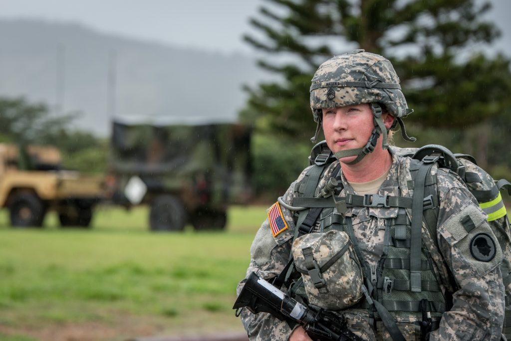 Staff Sgt. Krysta M. Waters of the 111th Army Band, 103rd Troop Command competes in the 12-mile ruck march during the Best Warrior Competition at Schofield Barracks, Hawaii Mar. 2, 2018. The Best Warrior Competition recognizes Soldiers who demonstrate commitment to the Army Values, embody the Warrior Ethos, and represent the Force of the Future.