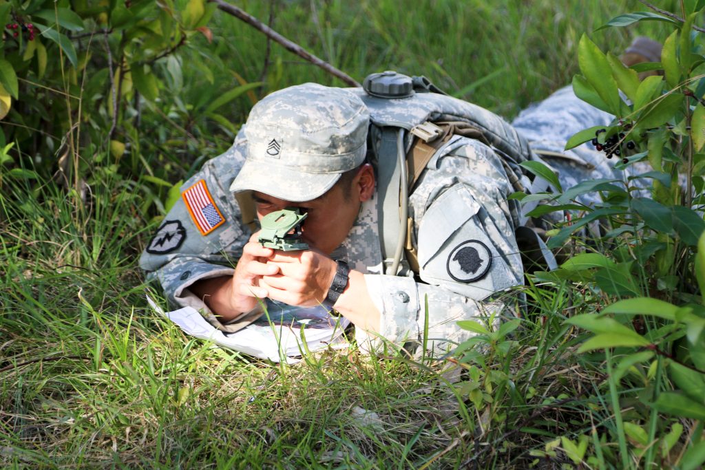 Staff Sgt. Paulo Napoles, a member of the Hawaii Army National Guard's Recruiting and Retention Battalion, uses his compass during the Land Navigation event while participating in the Hawaii Army National Guard's annual Best Warrior Competitition at Schofield Barracks in Wahiawa, H.I., on March 02, 2019. Soldiers battle to demonstrate their knowledge, skills, and abilities to prove they are the Best Warrior and receive a chance to compete at the regional level. (U.S. Army National Gaurd photo by Sgt. Kealalaulii Gandia/Released)