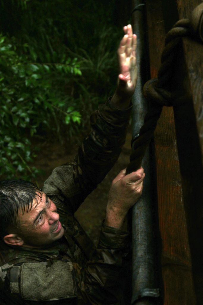 Hawaii Army National Guard Sgt. Eric R. Binger participates in the 2021 Hawaii Best Warrior Competition (BWC) rope climb event at Area X, Schofield Barracks, Hawaii, March 6, 2021. The BWC is an annual three day event that Soldiers and Non-Commissioned Officers of the Hawaii Army National Guard and Hawaii Army Reserve compete in to earn the title of "Best Warrior". The BWC tests the Soldiers' individual ability to adapt and overcome challenging scenarios and battle-focused events, testing their technical and tactical skills under stress and extreme fatigue. (U.S. Army National Guard photo by Sgt. Matthew A. Foster)