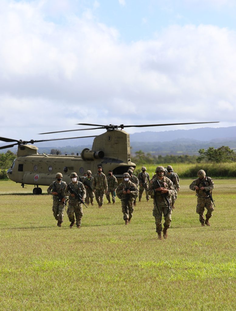 Hawaii Army National Guard (HIARNG) and Hawaii Army Reserve Soldiers exit the CH-47 Chinook at the conclusion of the land navigation event during the Best Warrior Competition (BWC), Schofield Barracks, Hawaii, March 6, 2021. The BWC is a three-day annual competition where Soldiers are tested to earn the title of the “Best Warrior” through many challenges including firing weapons, land navigation, a physical fitness test and various mystery events. (U.S. Army National Guard photo by Spc. Mariah-Alexsandra K. Manandic-Kapu)