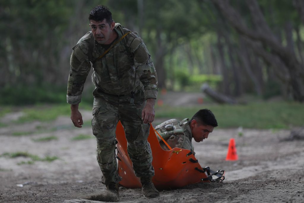 Hawaii Army National Guard Soldiers Sgt. Cooper Hulse, Cavalry Scout, assigned to Headquarters and Headquarters Squadron, 1-299th Cavalry Regiment and Spc. Quinn Mears, combat engineer, assigned to Alpha Company, 227th Brigade Engineering Battalion, participates in the Beach Party event during the Region VII Best Warrior Competition, Waimanalo, Hawaii, May 7-11 2023. The grueling five day competition tested service members on numerous warrior tasks, and included several events designed to test each service member’s mental and physical endurance. (U.S. Army National Guard Photo by Spc. Mariah-Alexsandra K. Manandic-Kapu)