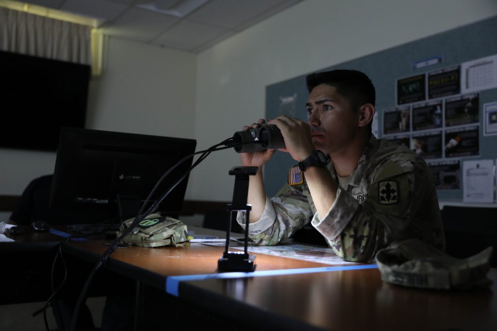 Hawaii Army National Guard Sgt. Cooper Hulse, a cavalry scout assigned to Headquarters and Headquarters Squadron, 1-299th Cavalry Regiment, simulates calling for fire using the Laser Shot Fires training simulator during the Army National Guard Region VII Best Warrior Competition, at the Regional Training Institute, Waimanalo, Hawaii, May 7-11, 2023. National Guard service members from Arizona, California, Colorado, Guam, Hawaii, Nevada, New Mexico and Utah competed against each other in Army Warrior Tasks to be named Regional Best Warrior. (U.S. Army National Guard photo by Spc. Sean Walker)