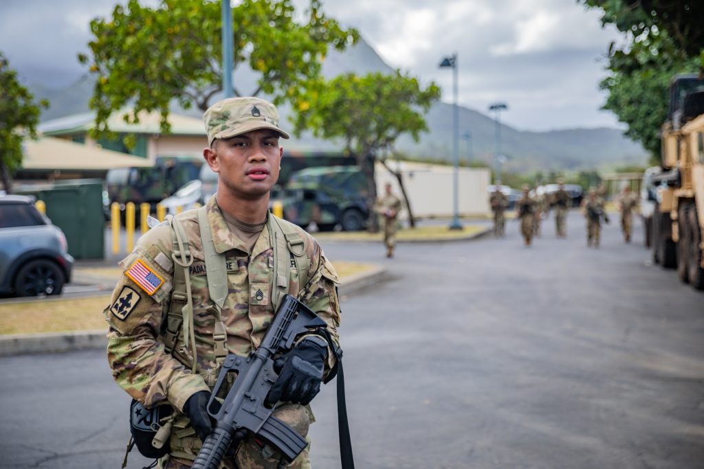 U.S. Army Staff Sgt. Bradley Padama-Kinere, left, a combat medic specialist assigned to Headquarters Headquarters Battalion, 1st Battalion, 487th Field Artillery Regiment, 29th Infantry Brigade Combat Team, Hawaii Army National Guard (HIARNG), poses for a photo during the HIARNG 2024 Best Warrior Competition at the Regional Training Institute, Waimanalo, Hawaii, April 5-7, 2024. The Best Warrior Competition is an annual event conducted by the HIARNG to identify the most skilled and proficient Soldiers across various military occupational specialties (MOS). (U.S. Army National Guard photo by Sgt. Lianne M. Hirano)