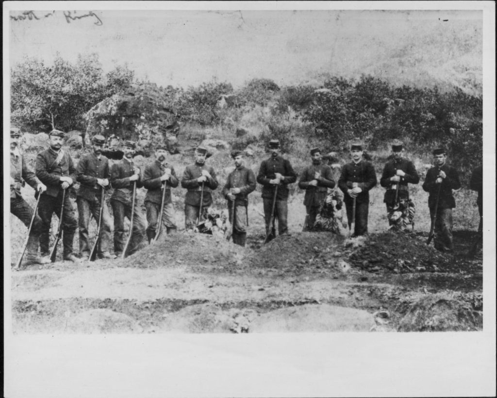 Firing Squad Company F of the National Guard of Hawaii, Kalalau Valley, Kauai - At grave of three members killed during hunt for Kaluaikoolau. Kaluaikoolau. a.k.a. Koolau the Leper.