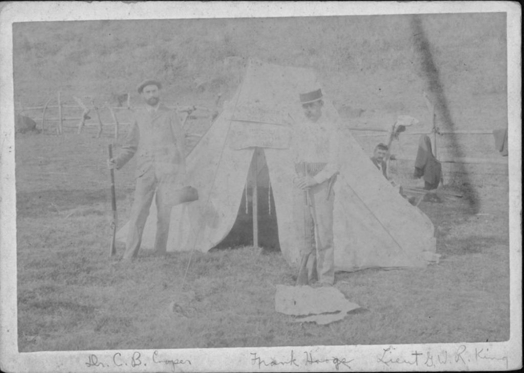 Medical camp of Company F, National Guard of Hawaii, in Kalalau Valley, Kauai - L. to R- Dr. C.B. Cooper, F.L. Hoogs, reporter, and 2nd. Lt. George W.R. King, during hunt for Koolau and others. Kaluaikoolau