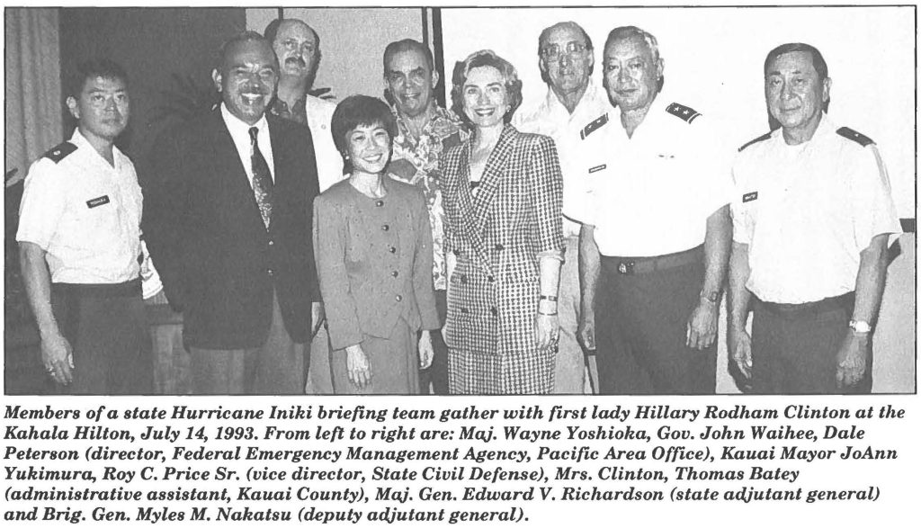 Members of a state Hurricane Iniki briefing team gather with first lady Hillary Rodham Clinton at the Kahala Hilton, July 14, 1993. From left to right are: Maj. Wayne Yoshioka, Gov. John Waihee, Dale Peterson (director, Federal Emergency Management Agency, Pacific Area Office), Kauai Mayor JoAnn Yukimura, Roy C. Price Sr. (vice director, State Civil Defense), Mrs. Clinton, Thomas Batey (administrative assistant, Kauai County), Maj. Gen. Edward V. Richardson (state adjutant general) and Brig. Gen. Myles M. Nakatsu (deputy adjutant general).