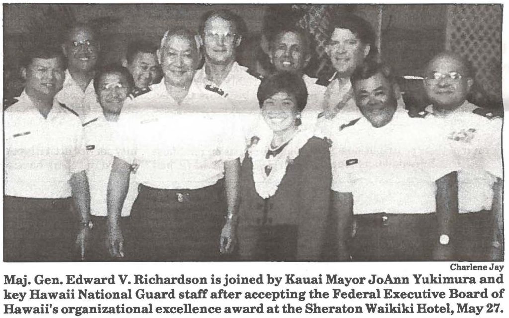 Maj. Gen. Edward V. Richardson is joined by Kauai Mayor JoAnn Yukimura and key Hawaii National Guard staff after accepting the Federal Executive Board of Hawaii's organizational excellence award at the Sheraton Waikiki Hotel, May 27.