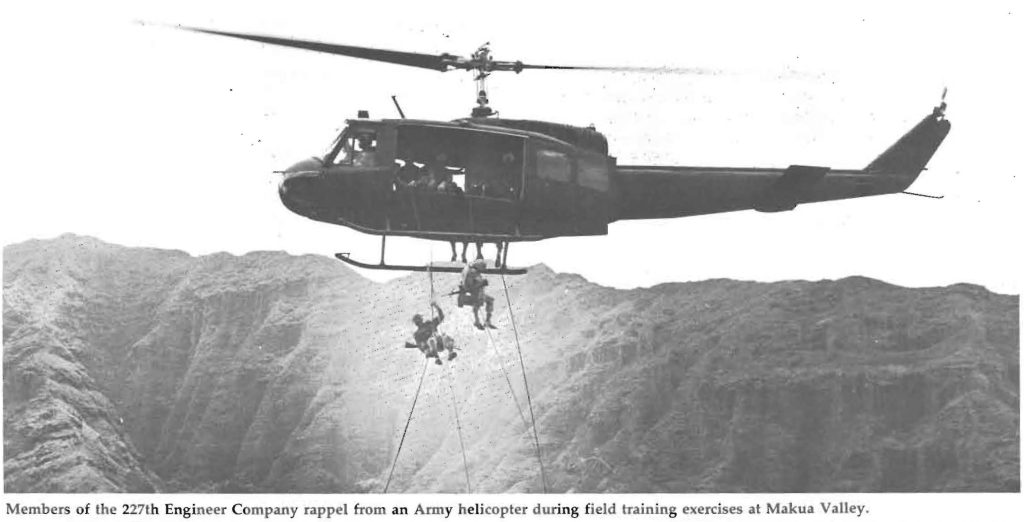 Members of the 227th Engineer Company rappel from an Army helicopter during field training exercises at Makua Valley.