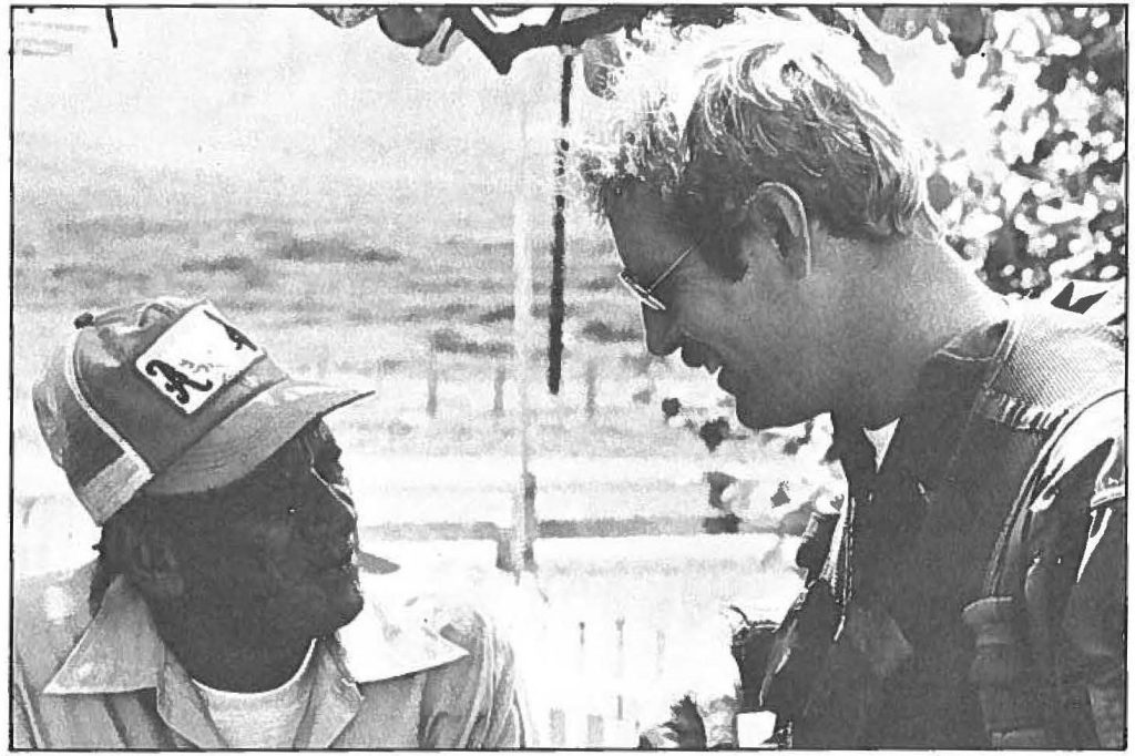 CHIEF WARRANT Officer Richard Wright, a HARNG helicopter pilot, chats with Kalaupapa resident John Kaona about the lack of water. Wright, along with other HARNG and HANG members, airlifted in fresh water and water pipe after heavy rains caused a breakdown in Kalaupapa's water system. The community's 150 residents and staff were without water for several days. 