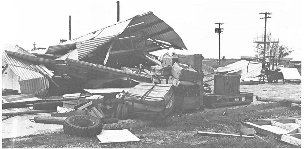 GUARD LOSSES-Officials evaluate losses at the 202nd ATCF at Barking Sands, Kauai. Guard facilities suffered more than $1.2 million in damages during Hurricane lwa.