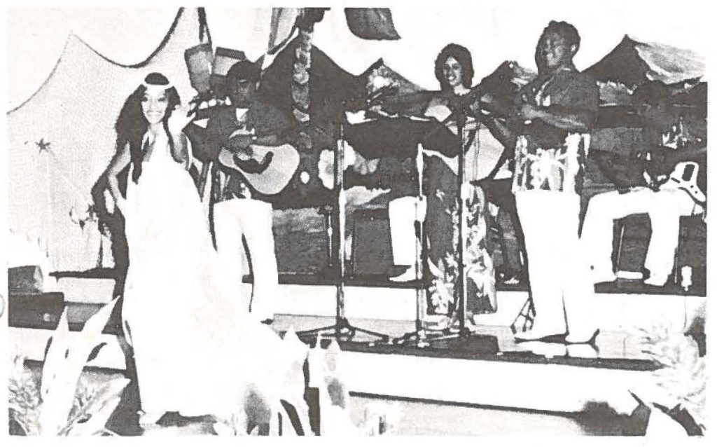 Sgt. Blossom Lee (foreground) and the members of the HANG Ohana perform a medley of Hawaiian songs and dances for their JASDF and Air Force hosts. Ohana members include (left to right): SSgt. Danny Tengan, Sgt. Mamo McCallum, MSgt. William Akiona and Sgt. Ron Cozo.