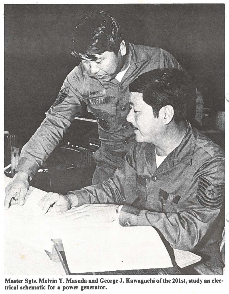Master Sgts. Melvin Y. Masuda and George J. Kawaguchi of the 201st, study an electrical schematic for a power generator.