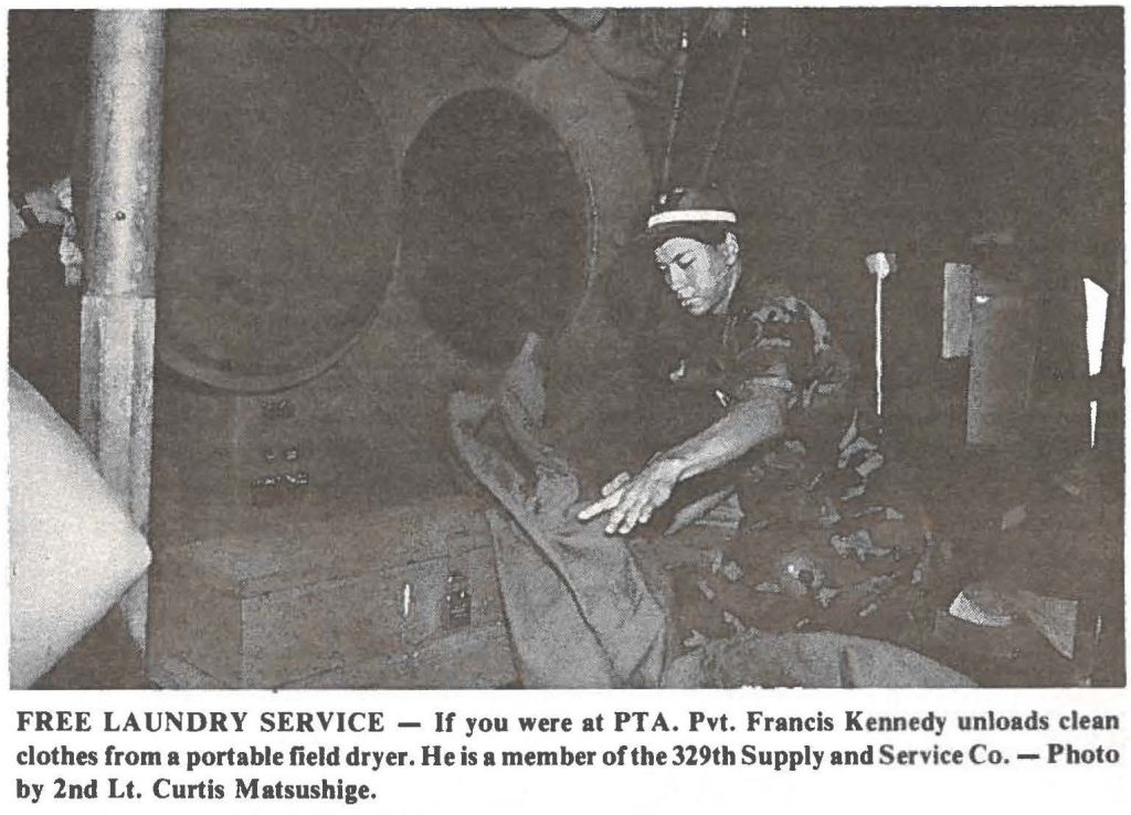 FREE LAUNDRY SERVICE - If you were at PTA. Pvt. Francis Kennedy unloads clean clothes from a portable field dryer. He is a member of the 329th Supply and Service Co. - Photo by 2nd Lt. Curtis Matsushige.
