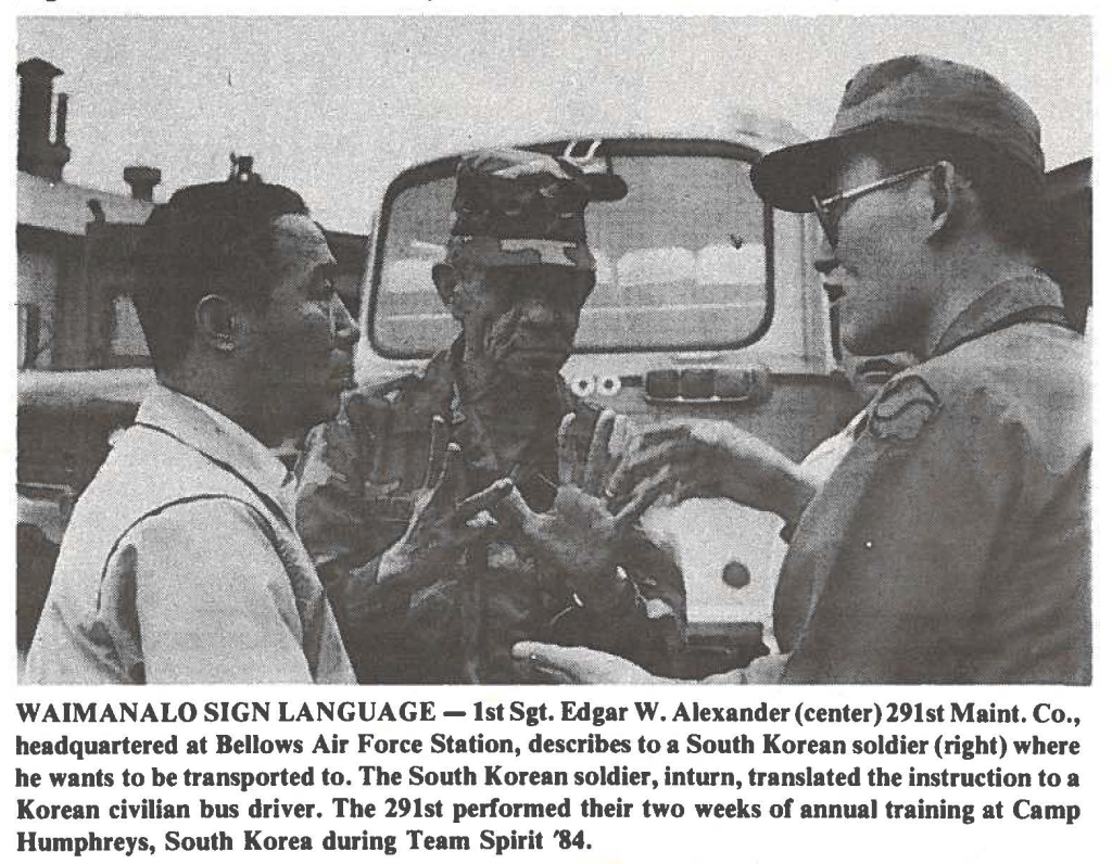 WAIMANALO SIGN LANGUAGE-1st Sgt. Edgar W. Alexander (center) 291st Maint. Co., headquartered at Bellows Air Force Station, describes to a South Korean soldier (right) where he wants to be transported to. The South Korean soldier, inturn, translated the instruction to a Korean civilian bus driver. The 291st performed their two weeks of annual training at Camp Humphreys, South Korea during Team Spirit '84.