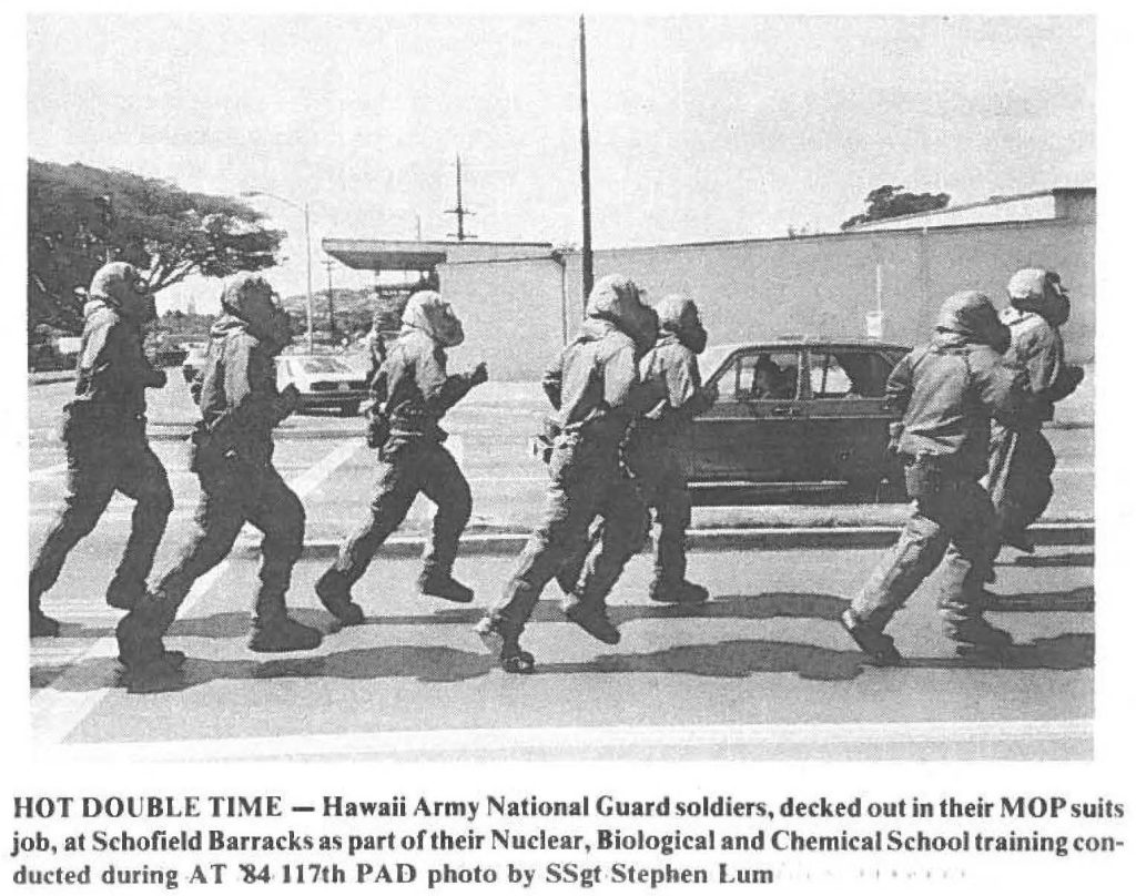HOT DOUBLE TIME - Hawaii Army National Guard soldiers, decked out in their MOP suits job, at Schofield Barracks as part of their Nuclear, Biological and Chemical School training conducted during AT '84 117th PAD photo by SSgt Stephen Lum