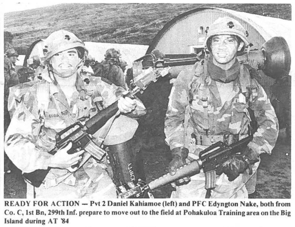 READY FOR ACTION - Pvt 2 Daniel Kahiamoe (left) and PFC Edyngton Nake, both from
Co. C, 1st Bn, 299th Inf. prepare to move out to the field at Pohakuloa Training area on the Big
Island during AT '84