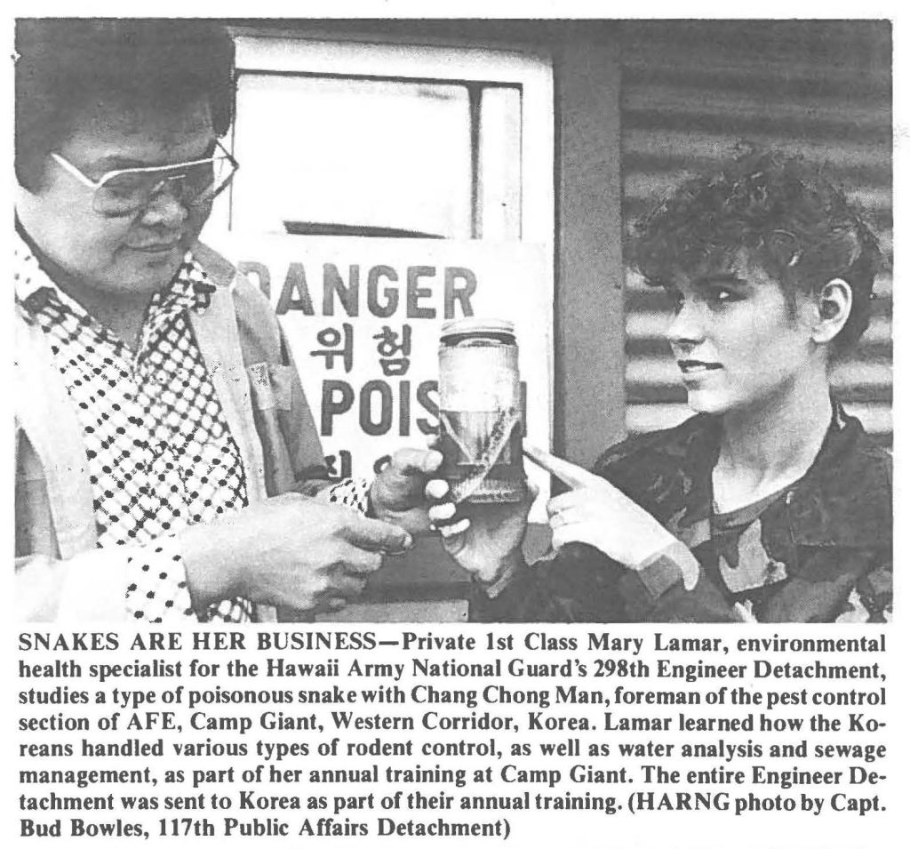 SNAKES ARE HER BUSINESS-Private 1st Class Mary Lamar, environmental health specialist for the Hawaii Army National Guard's 298th Engineer Detachment, studies a type of poisonous snake with Chang Chong Man, foreman of the pest control section of AFE, Camp Giant, Western Corridor, Korea. Lamar learned how the Koreans handled various types of rodent control, as well as water analysis and sewage management, as part of her annual training at Camp Giant. The entire Engineer Detachment was sent to Korea as part of their annual training. (HARN G photo by Capt. Bud Bowles, 117th Public Affairs Detachment)