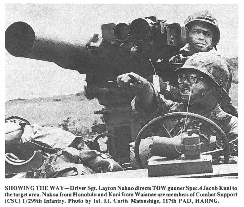 SHOWING THE WAY-Driver Sgt. Layton Nakao directs TOW gunner Spec.4 Jacob Kuni to the target area. Nakoa from Honolulu and Kuni from Waianae are members or Combat Support (CSC) 1/299th Infantry. Photo by 1st. Lt. Curtis Matsushige, 117th PAD, HARNG.