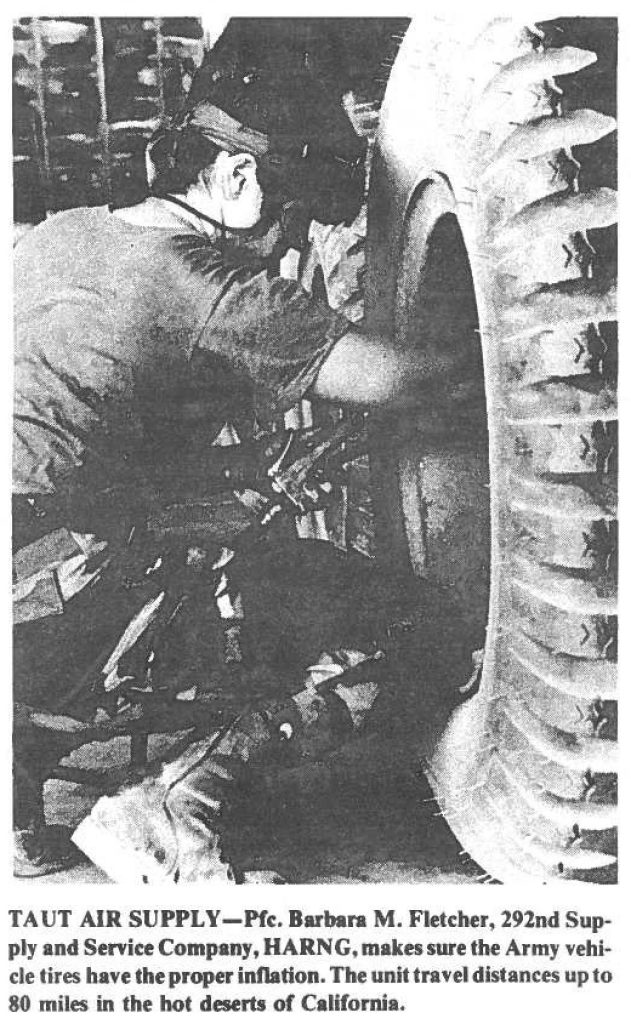 TAUT AIR SUPPLY-Pfc. Barbara M. Fletcher, 292nd Supply and Service Company, HARNG, makes sure the Army vehicle tires have the proper inflation. The unit travel distances up to 80 miles in the hot deserts of California.