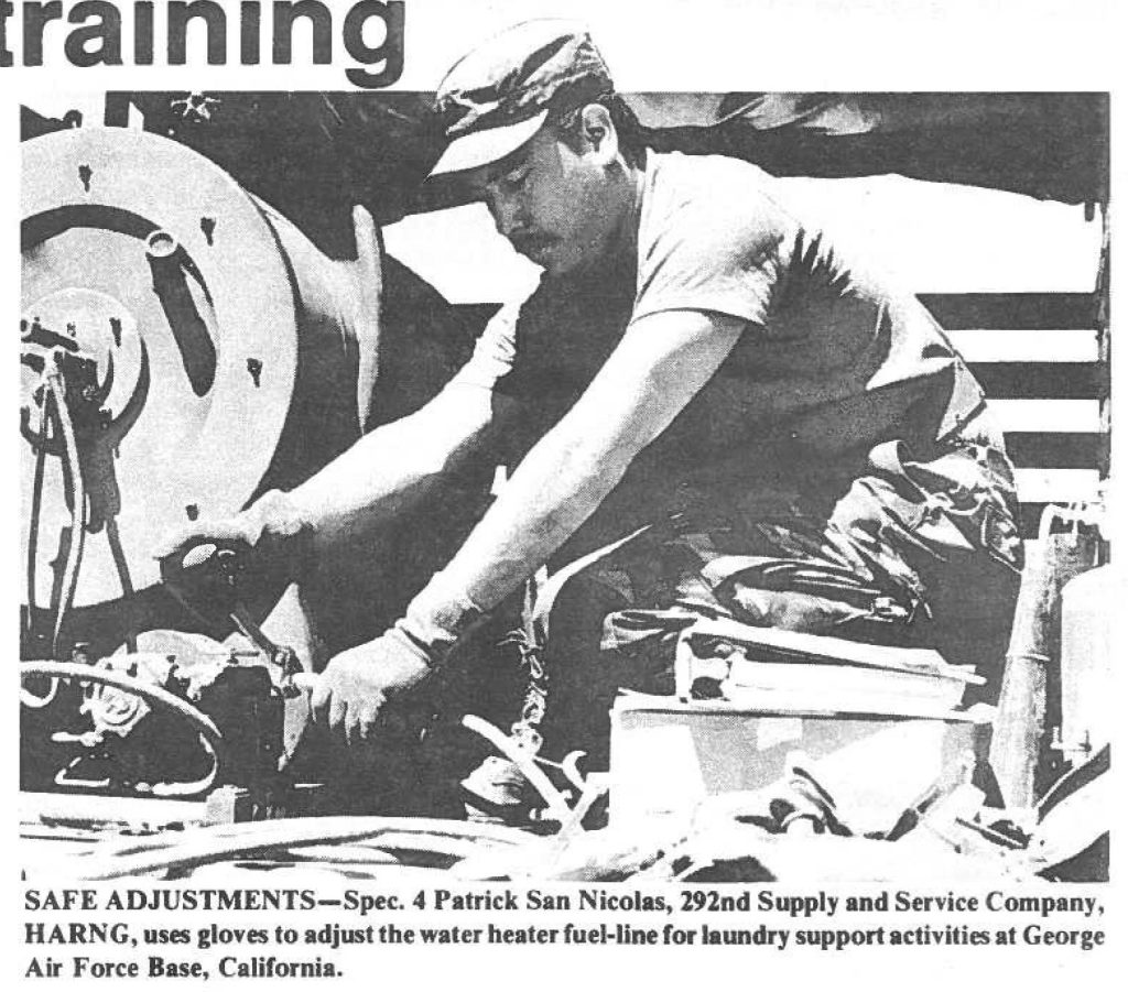 SAFE ADJUSTMENTS-Spec. 4 Patrick San Nicolas, 292nd Supply and Service Company, HARNG, uses gloves to adjust the water heater fuel-line for laundry support activities at George Air Force Base, California.