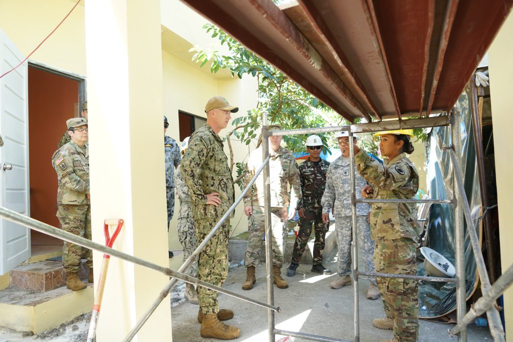 Sgt. Mary Rose Reiner, Hawaii Army National Guard 230th Engineer Company explains the improvements made to the water supply systems of a birthing center during Pacific Partnership Philippines 2019 to key leadership including Hawaii Adjutant General Brig. Gen. Arthur Logan and Pacific Partnership Mission Commander Capt. Randy Van Rossum in Tacloban, Philippines, March 21, 2019. The renovations were made as part of the Engineering Civic Action Program (ENCAP) portion of Pacific Partnership 2019. Pacific Partnership's mission is to work collectively with host and partner nations to enhance regional interoperability and disaster response capabilities, increase stability and security in the region, and foster new and enduring friendships across the Indo-Pacific region. Pacific Partnership, now in its 14th iteration, is the largest annual multinational humanitarian assistance and disaster relief preparedness mission conducted in the Indo-Pacific region. (U.S. Air National Guard Photo by Tech. Sgt. Andrew Jackson)
