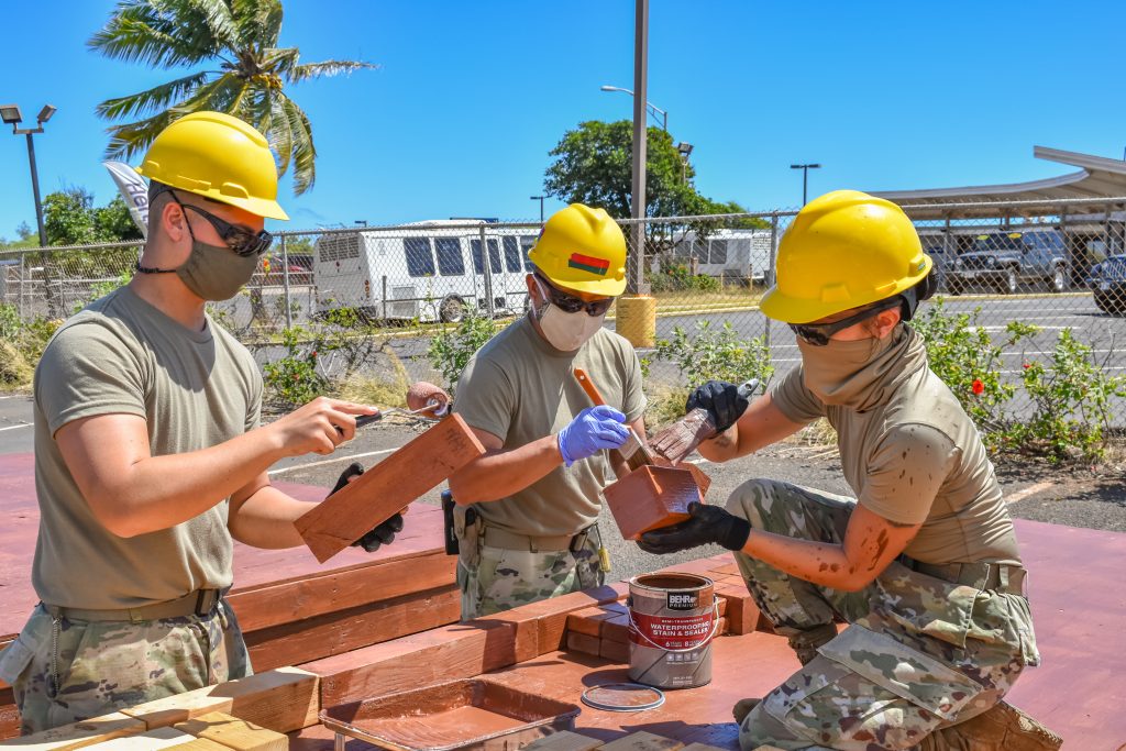 Hawaii Army National Guard Soldiers with 230th Engineer Company, 103rd Troop Command, utilize their technical expertise to paint and seal wooden platforms they've constructed that will help Maui county residents affected by the coronavirus during the COVID-19 pandemic, Kahului, Hawaii, June 3, 2020. (U.S. Army National Guard photo by Sgt. 1st Class Theresa Gualdarama)