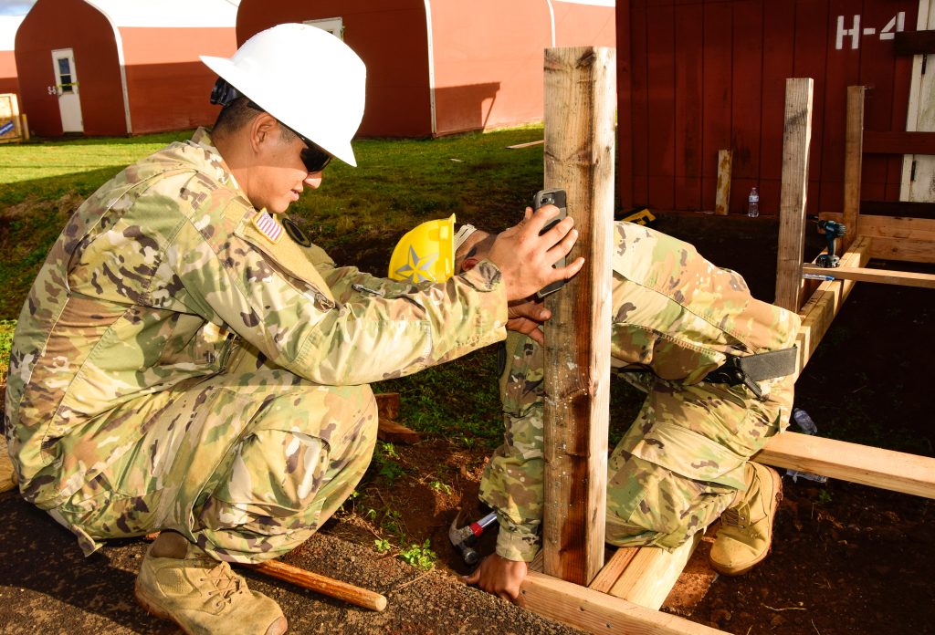Hawaii Army National Guard Soldiers with 230th Engineer Company, 103rd Troop Command, utilize their trade to construct bridges between structures and roads on Schofield Barracks, Hawaii, March 1, 2019. (U.S. Army National Guard photo by Sgt. 1st Class Theresa Gualdarama)