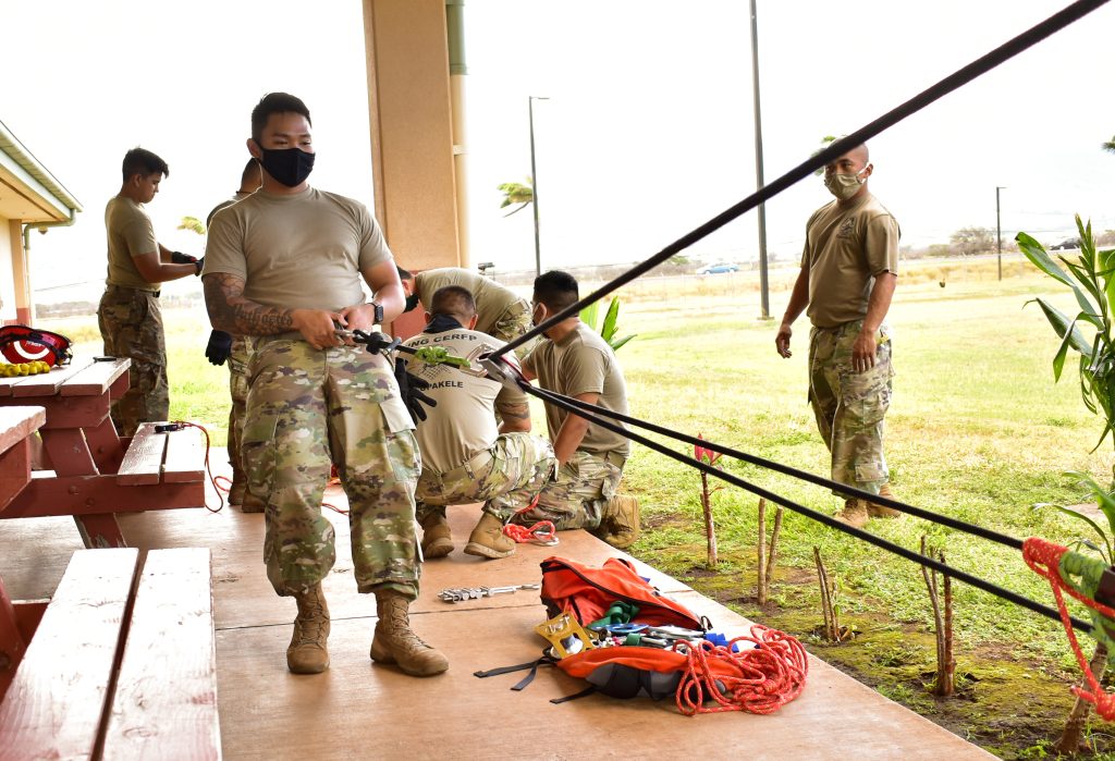 Hawaii Army National Guard Soldiers with 230th Engineer Company, 103rd Troop Command conduct ropes refresher training during COVID-19 operations on the island of Maui, Kihei, Hawaii, May 16, 2020. This type of training is vital to the search and extraction mission conducted by members of the Chemical, Biological, Radiological, Nuclear, and Explosive (CBRNE) Enhanced Response Force Package (CERFP). (U.S. Army National Guard photo by Sgt. 1st Class Theresa Gualdarama)