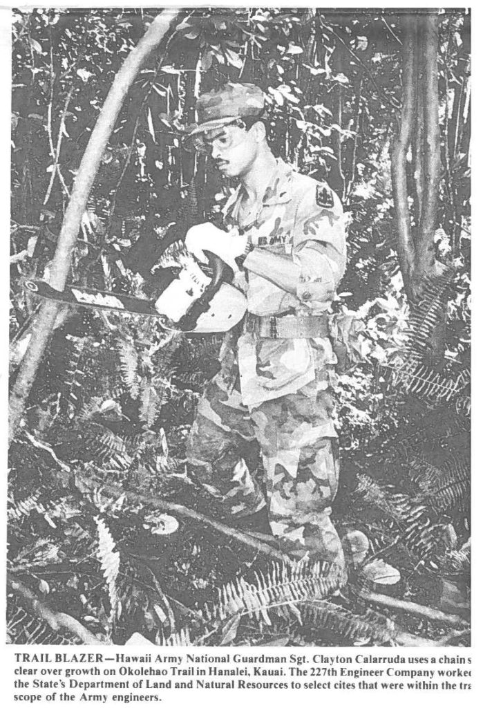 TRAIL BLAZER-Hawaii Army National Guardsman Sgt. Clayton Calarruda uses a chains clear over growth on Okolehao Trail in Hanalei, Kauai. The 227th Engineer Company worked the State's Department of Land and Natural Resources to select cites that were within the training scope of the Army engineers.