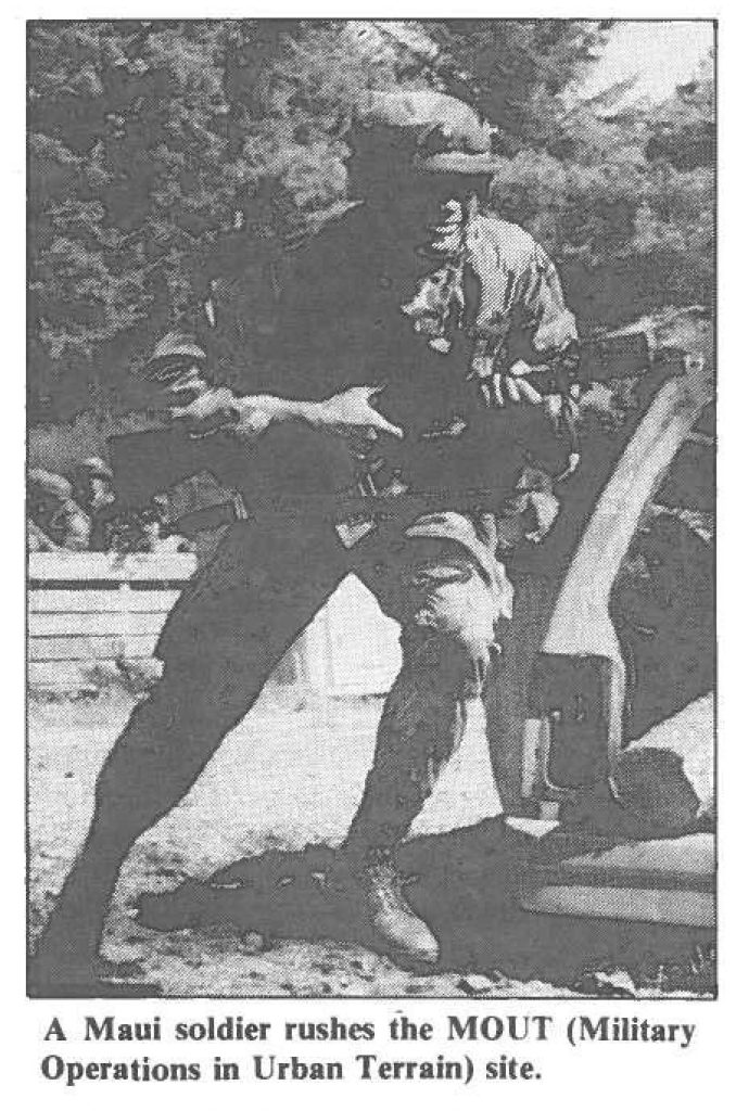 A Maui soldier rushes the MOUT (Military Operations in Urban Terrain) site.