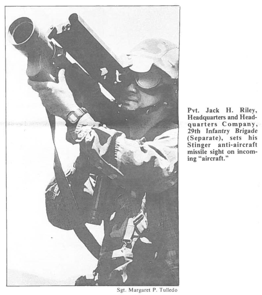 Pvt. Jack H. Riley, Headquarters and Headquarters Company, 29th Infantry Brigade (Separate), sets his Stinger anti-aircraft missile sight on incoming "aircraft."